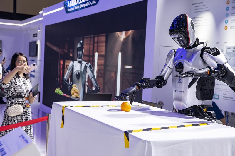 A gesture-controlled robot during the 2024 World AI Conference in Shanghai on July 6, 2024.jpg