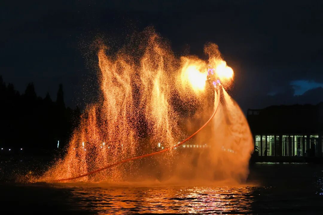 A fire performer puts on a show above the water..jpg