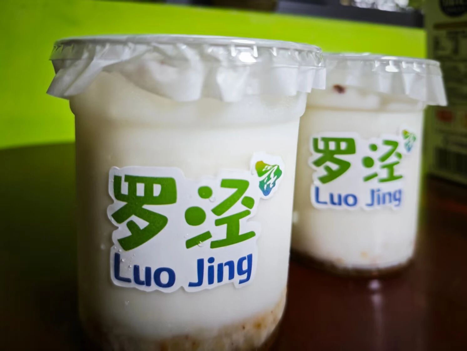 Osmanthus fermented rice milk features the logo of Luojing town.jpg