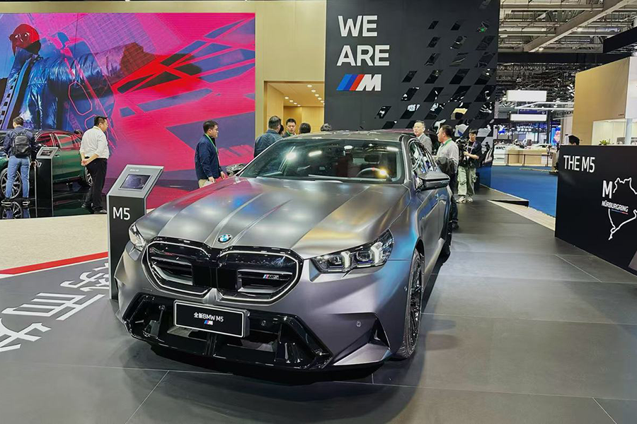 A BMW M5 is seen at the BMW booth at the 7th China International Import Expo. 拷贝.png