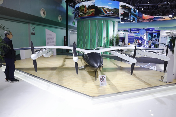 Visitors watch the electric vertical take-off and landing vehicle M1 independently developed by startup company Vertaxi at the 2024 China Brand Day events in Shanghai, on May 12, 2024..jpg Visitors watch the electric vertical take-off and landing vehicle M1 independently developed by startup company Vertaxi at the 2024 China Brand Day events in Shanghai, on May 12, 2024..jpg