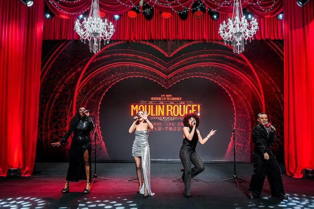 Cast members of Moulin Rouge! The Musical perform on stage at a shopping zone in Xuhui..jpg