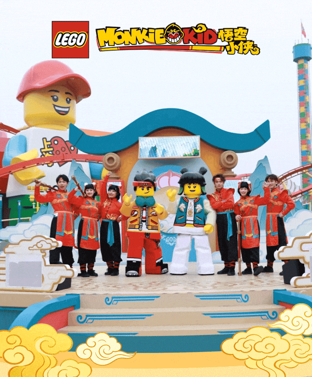 Performers pose with Lego Monkie Kid characters.gif