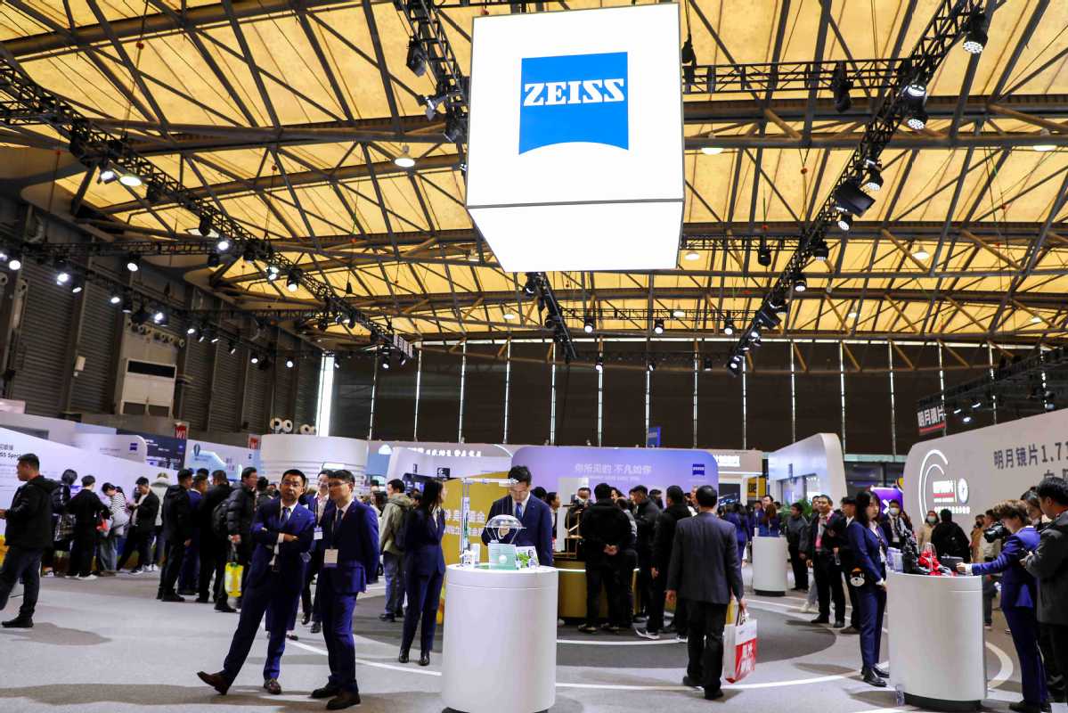 Visitors gather at the Zeiss booth during an expo in Shanghai on Feb 20. .jpeg