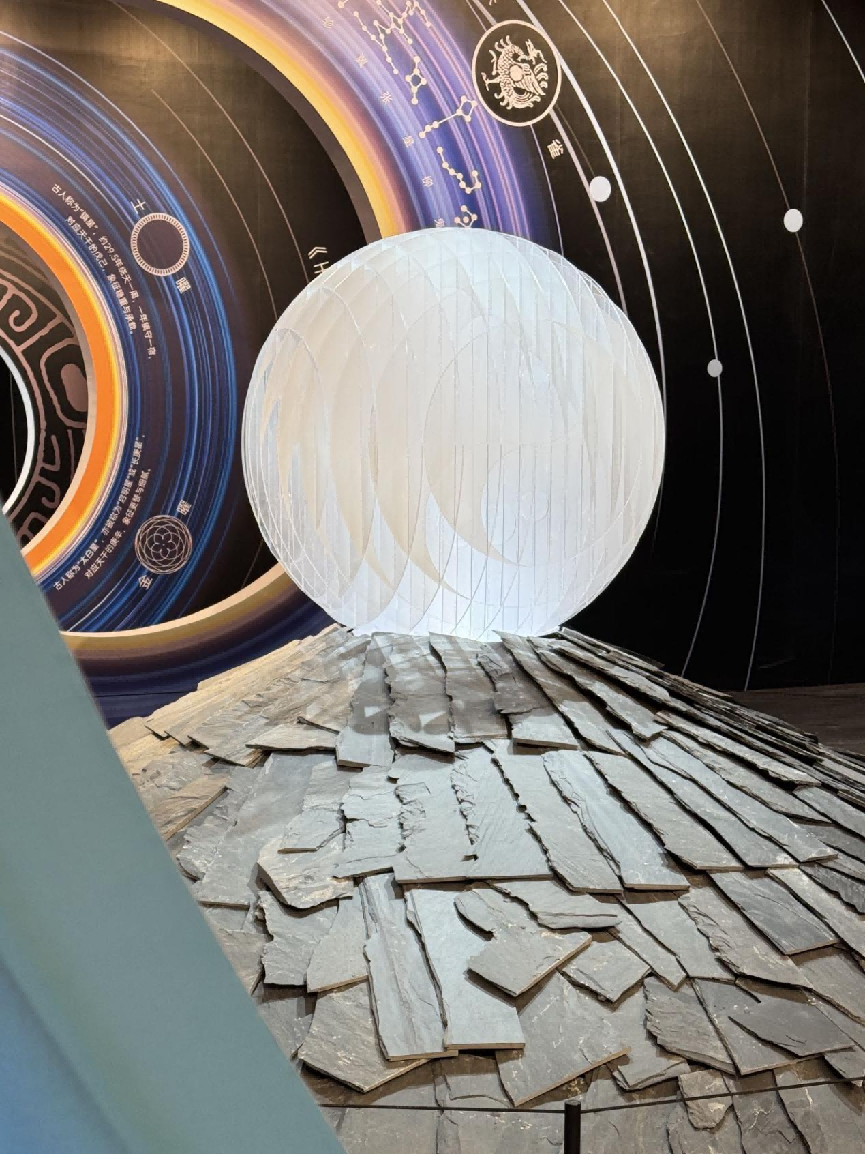 An art installation featuring ancient Chinese characters and celestial constellations at the exhibition.png
