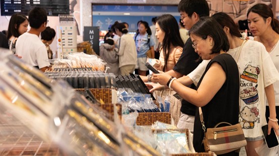 Visitors browse and purchase cultural products.jpg