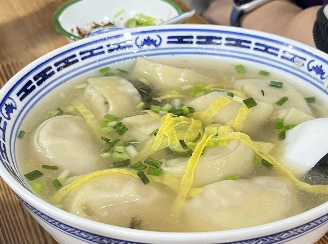 Wontons are garnished with thin strips of pan-fried egg.jpg