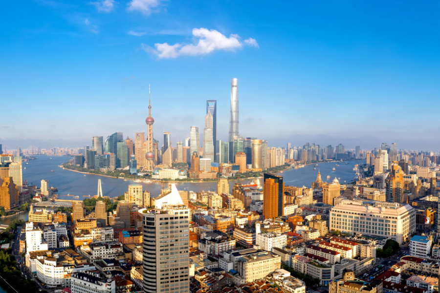 High-rises dominate the skyline on both sides of the Huangpu River in Shanghai. [Photo by Gao Erqiang China Daily].png