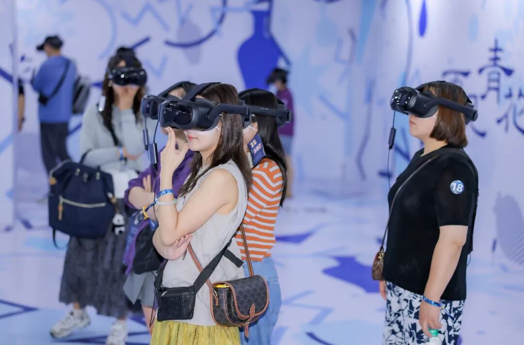 Visitors wear VR headsets to experience the exhibition.jpg