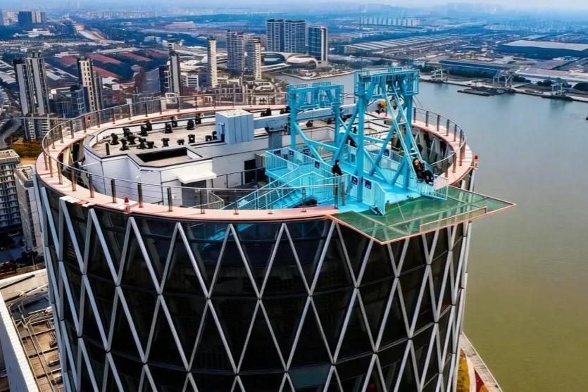 Shanghai's 180-meter 'sky swing' draws thrill seekers 