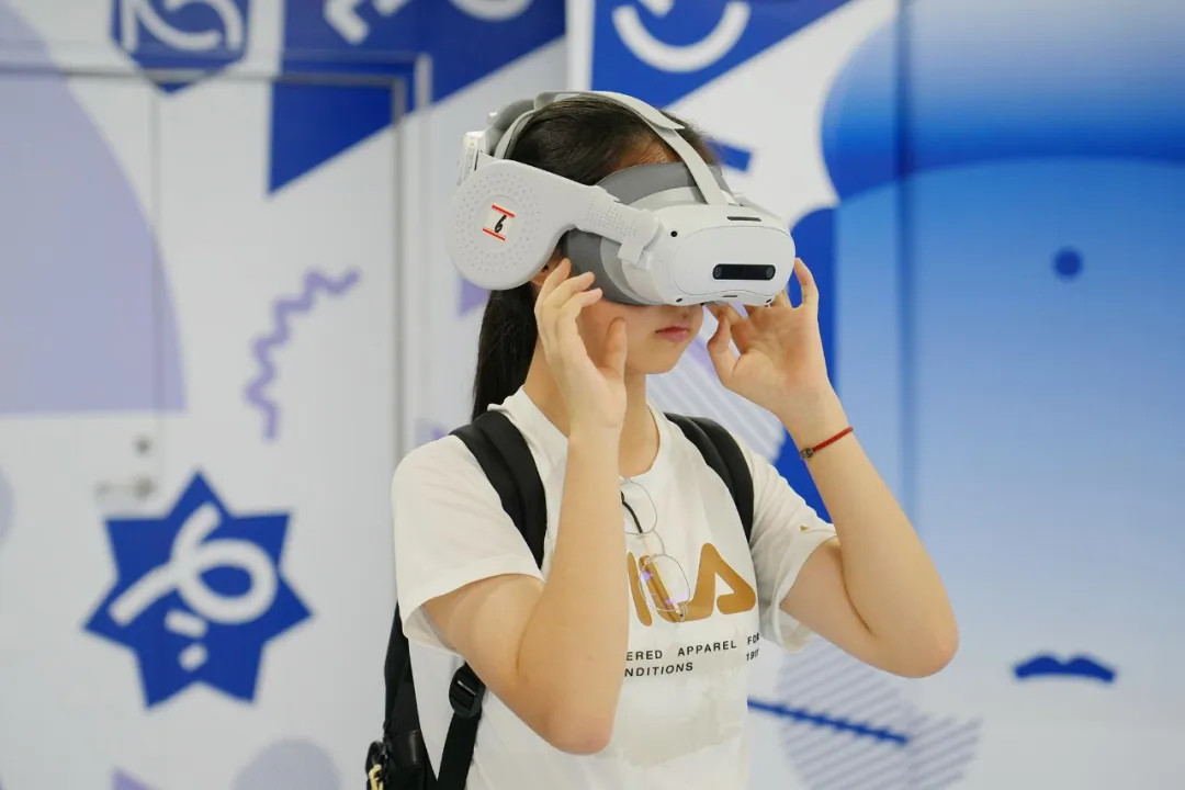 A visitor wears an XR headset while experiencing the Dunhuang culture.jpg