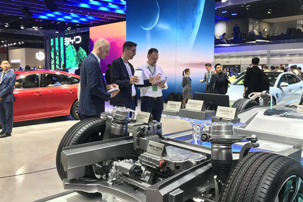 Visitors check out a BYD platform at the 2023 Shanghai auto show..jpeg