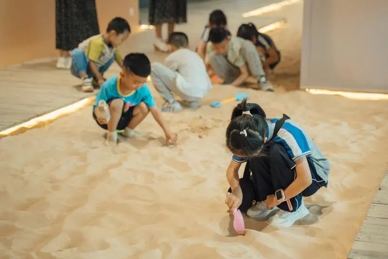 Kids dig for treasure in the sand.jpg