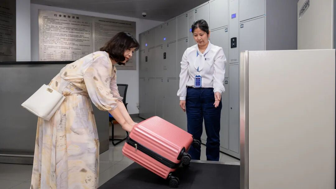 A traveler goes through luggage security check at the airport.jpg