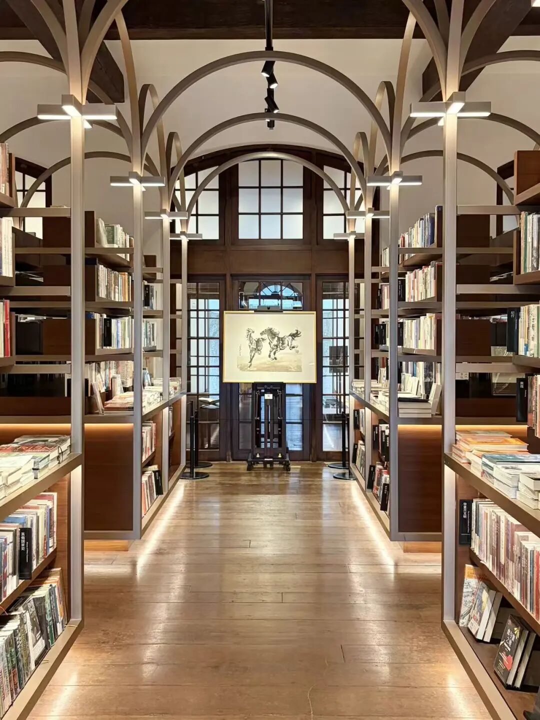 A horse-themed woodblock printing is displayed in the center of the Tsutaya Books..jpg