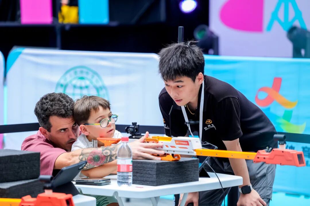 International visitors take aim at the opening carnival.jpg