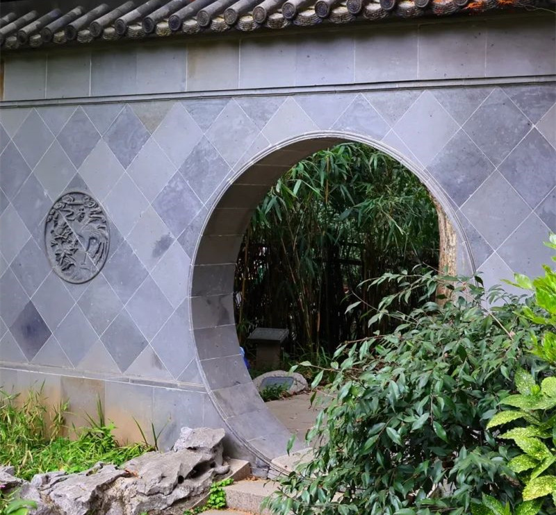 Traditional Chinese architecture and bamboo complement one another, creating a serene atmosphere.jpg