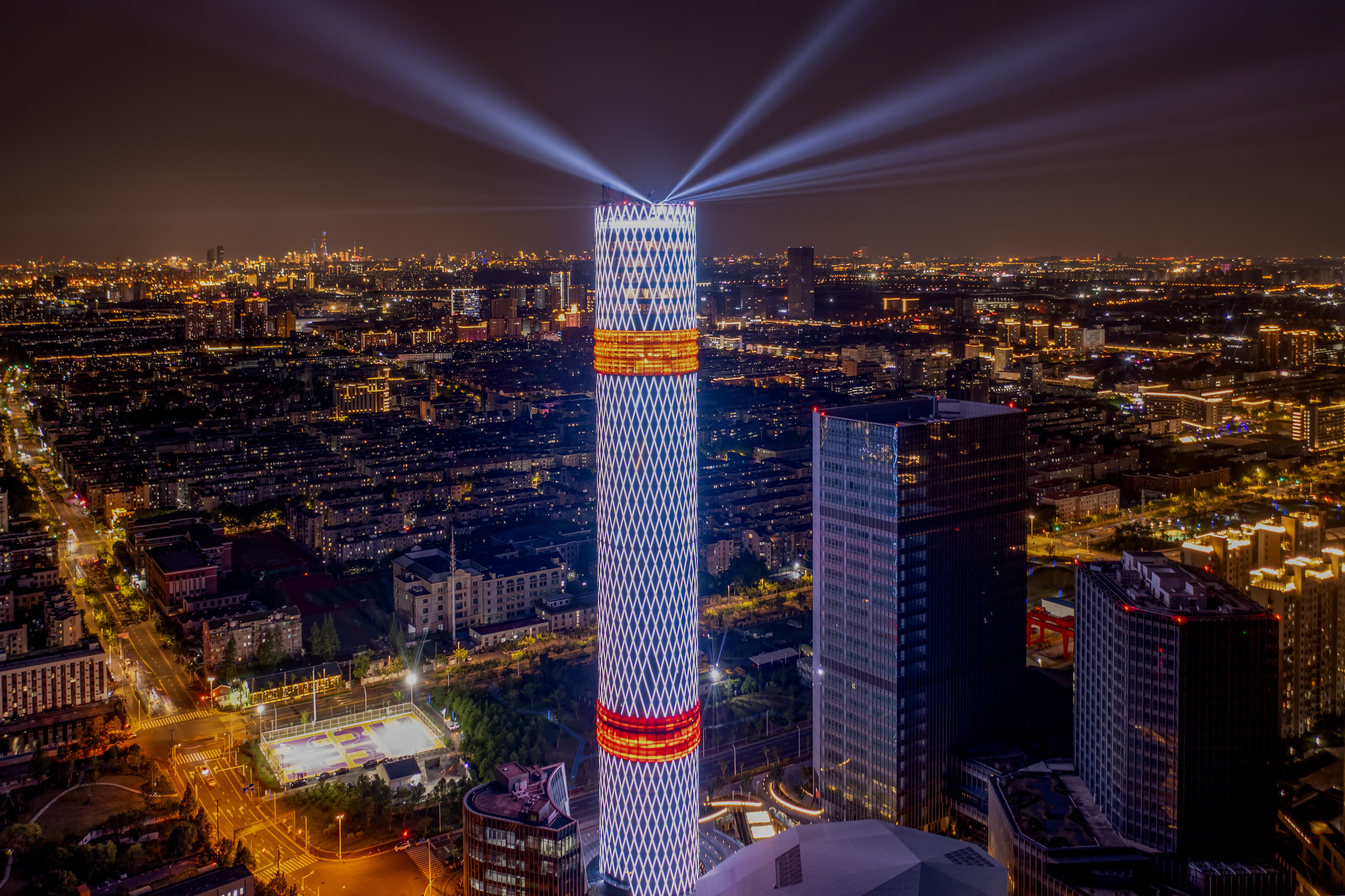 ​The Long Beach Tower illuminates against the night sky.jpeg