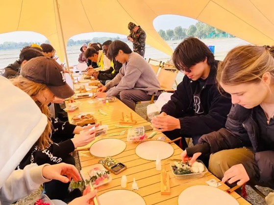 Intl students embrace the art of Chinese fan crafting at SHUPL