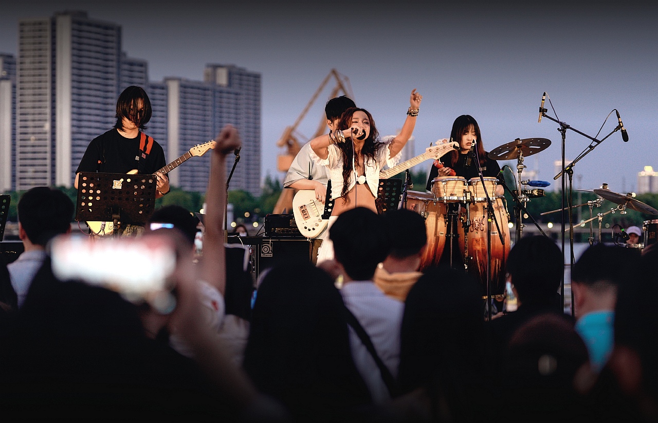 The audience delights in the musical artist