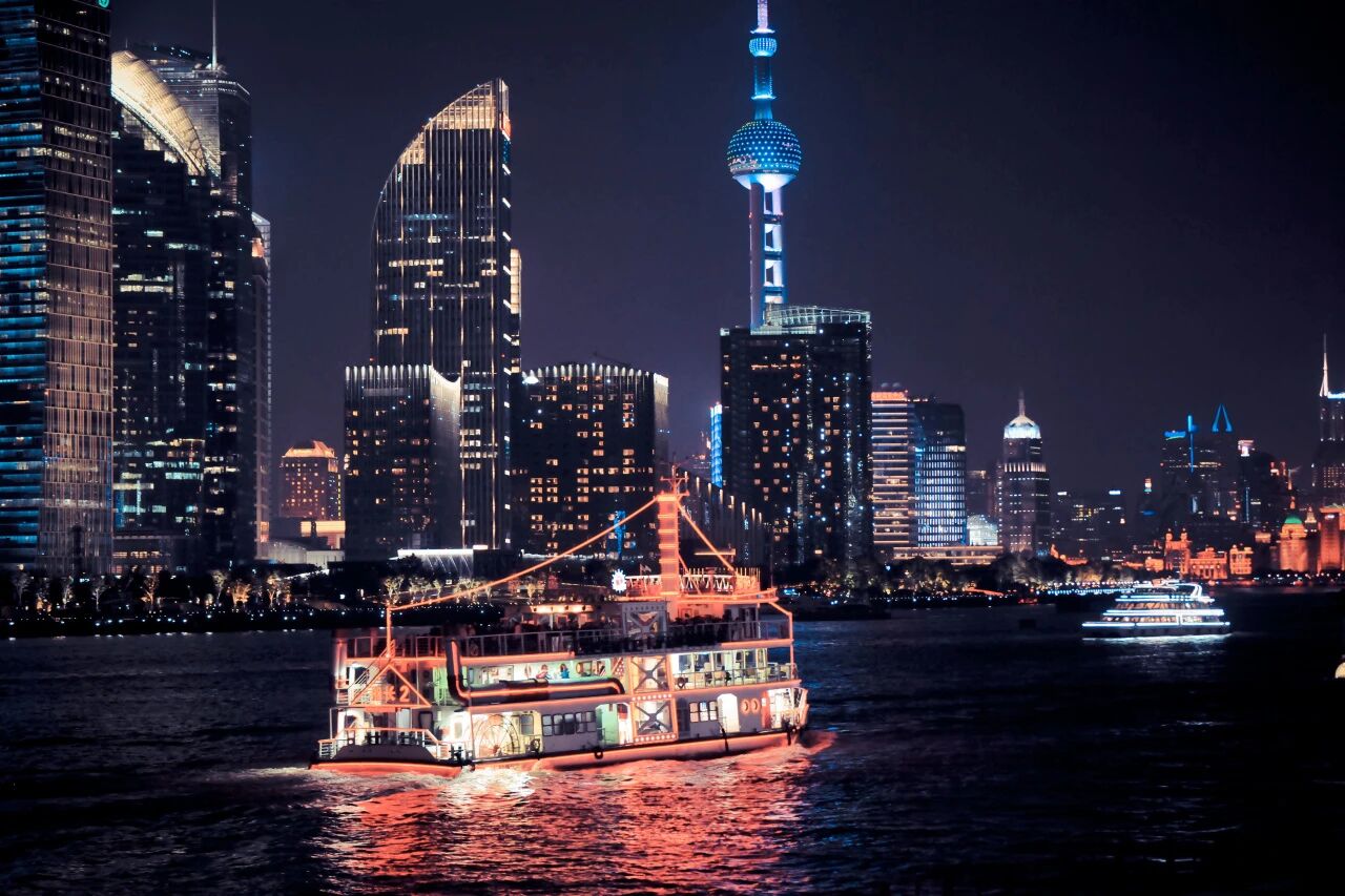 Cruise ships glide along the Huangpu River.jpg