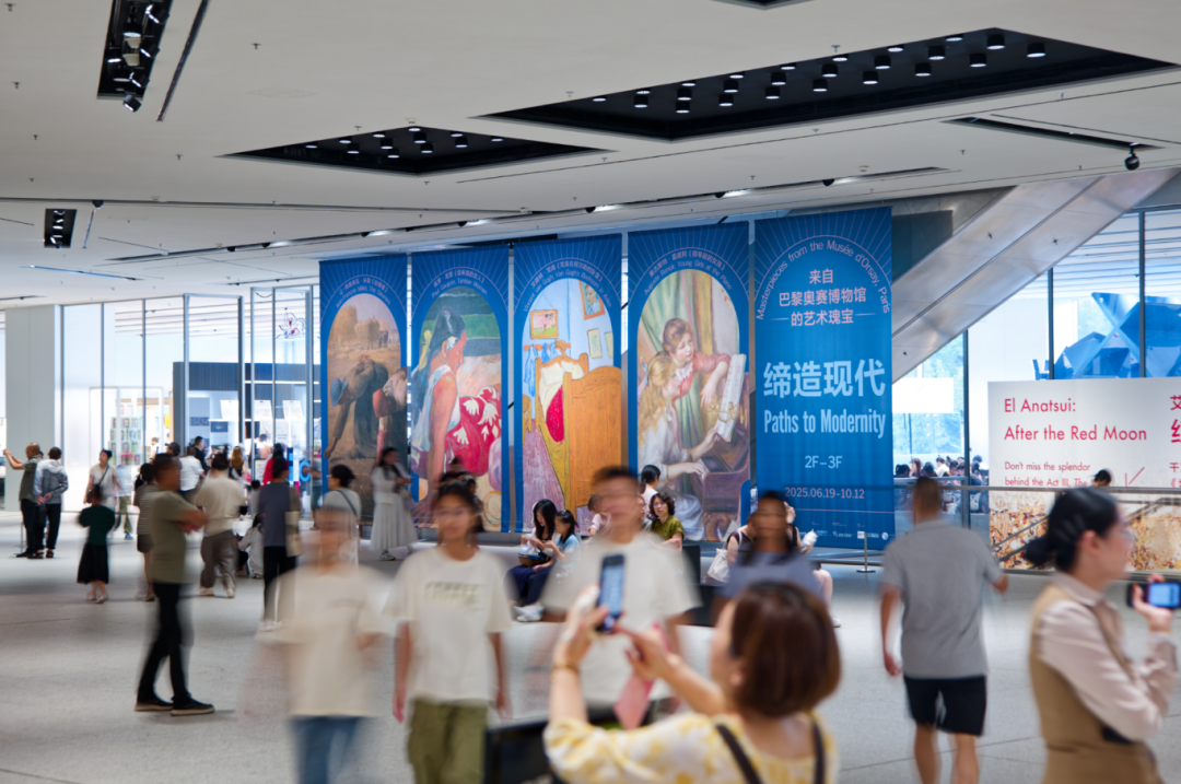 Visitors take photos outside the exhibition hall.png