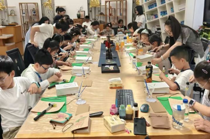 Children participate in a craft activity at the exposition.jpg