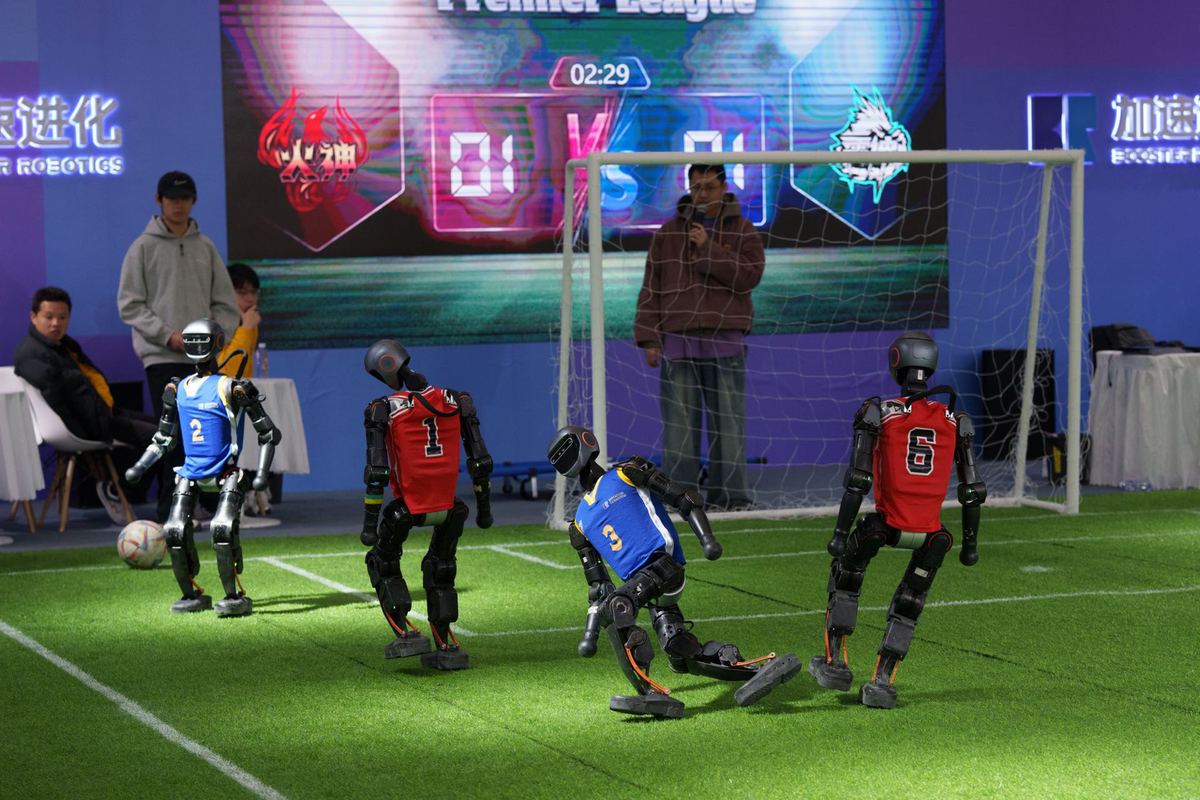 At the 2025 Global Developer Conference, robots play soccer live on stage, Feb 21, 2025..jpeg