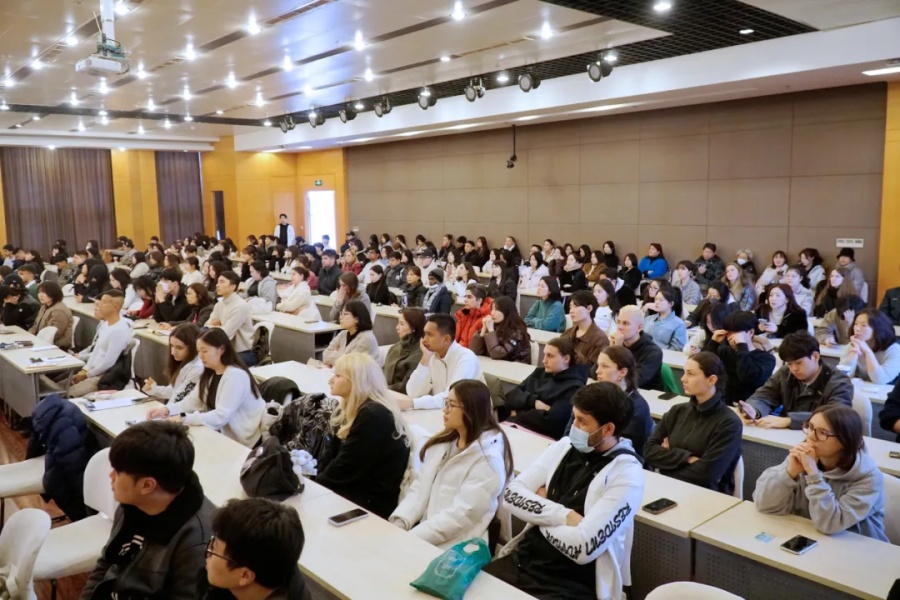 Students listen attentively to the speeches at the orientation..jpg