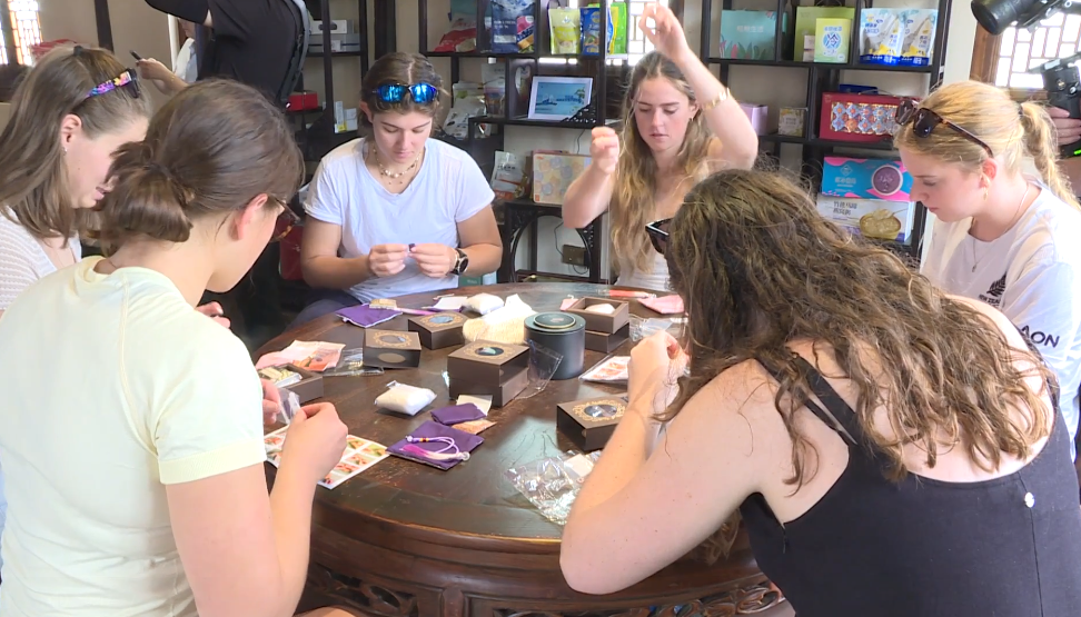 The athletes learn to make herbal sachets.png