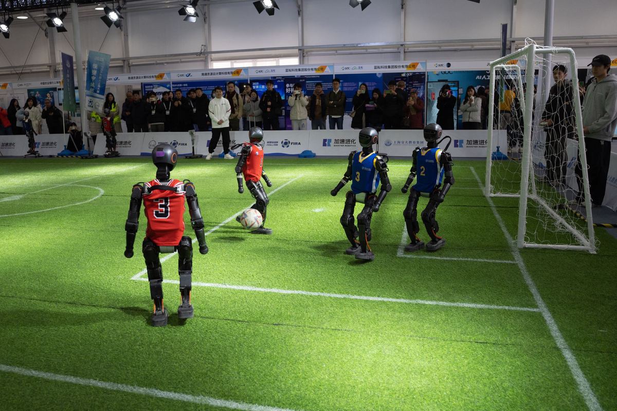 At the 2025 Global Developer Conference, robots play soccer live on stage, Feb 21, 2025. .jpeg