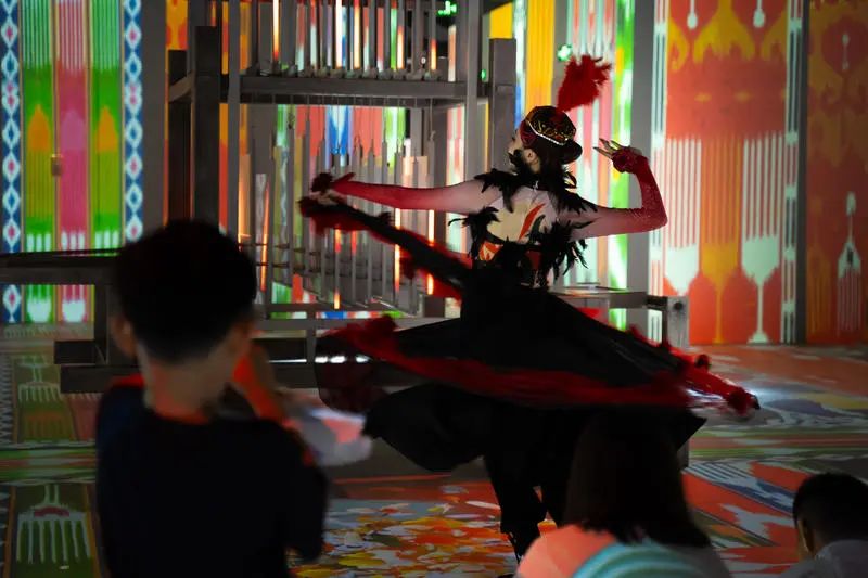 The exhibition features traditional dances from the ethnic groups of Xinjiang.jpg